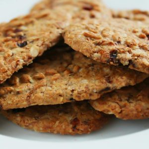 Close-up of homemade oatmeal cookies with raisins, a healthy treat.