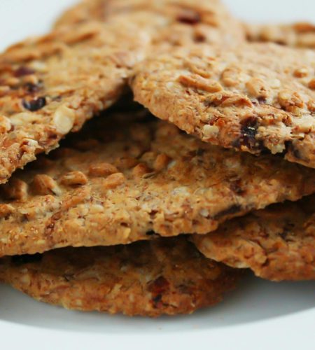 Close-up of homemade oatmeal cookies with raisins, a healthy treat.